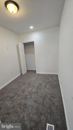 an empty room with a sink