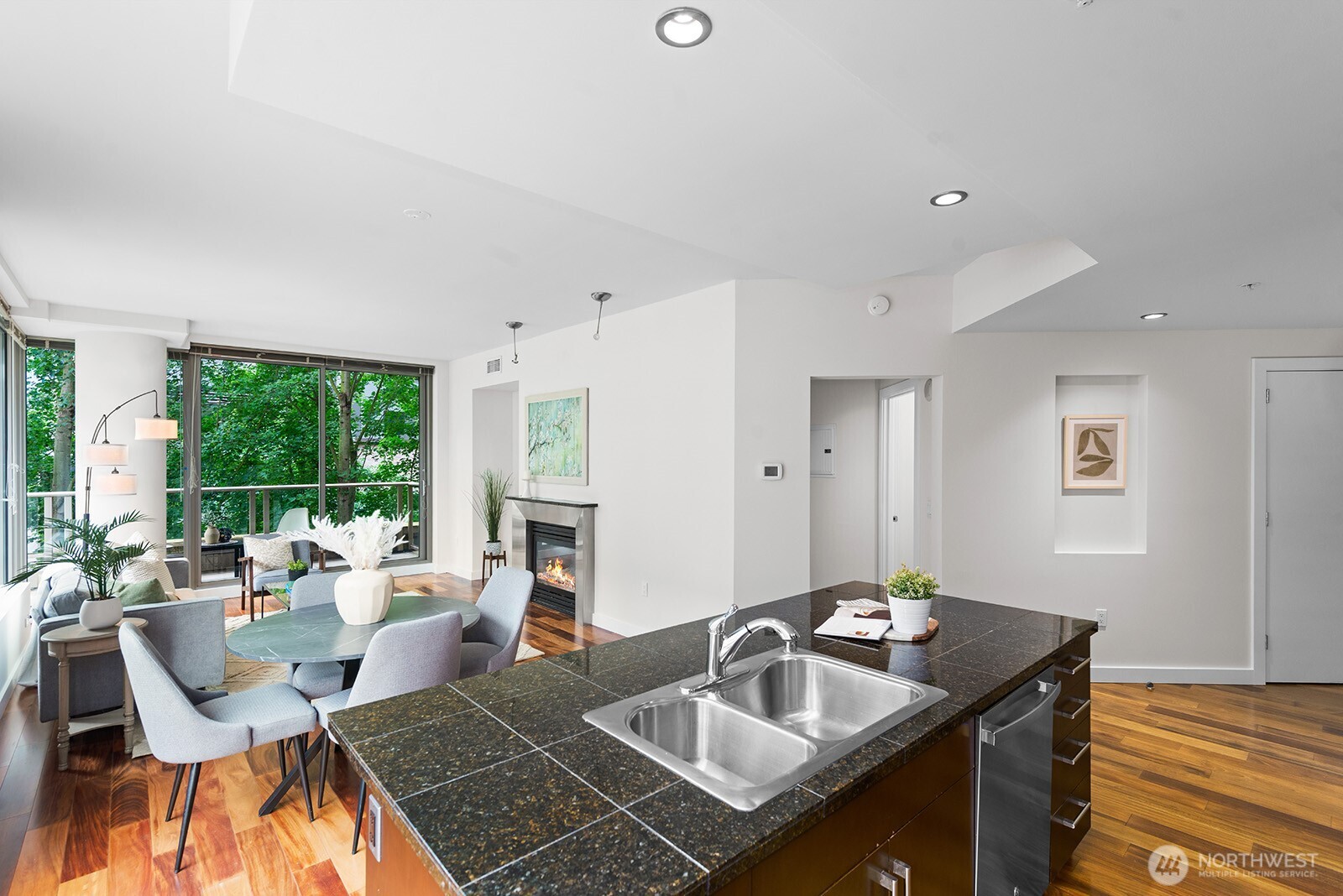 910 Lenora Street, Unit S403 Seattle, WA 98121 - Photo 11 of 40 a dining room with furniture a large window and a fireplace