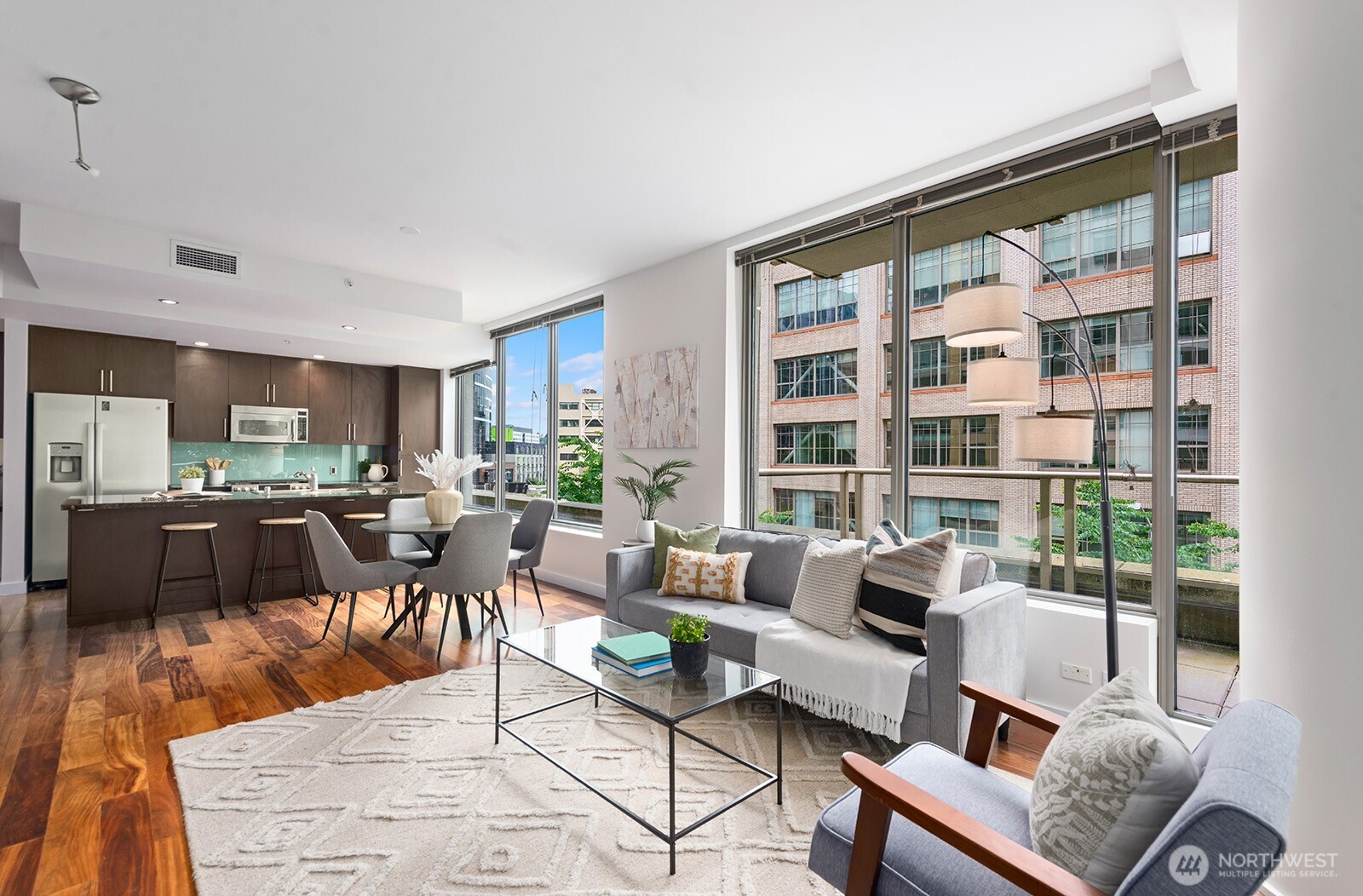 910 Lenora Street, Unit S403 Seattle, WA 98121 - Photo 14 of 40 a living room with furniture and a large window