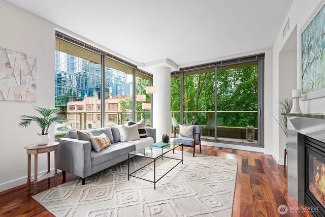 a living room with furniture and a large window