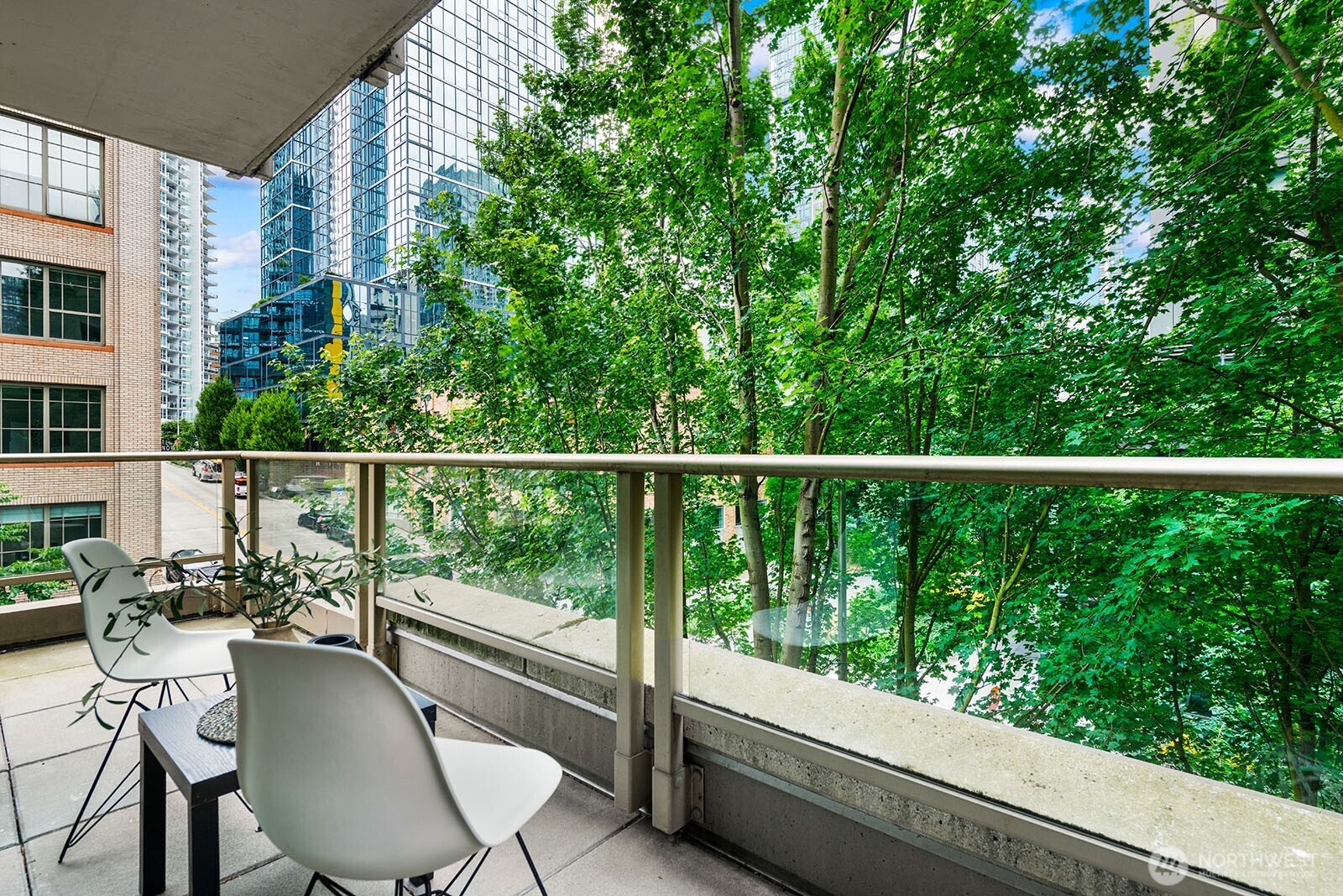 910 Lenora Street, Unit S403 Seattle, WA 98121 - Photo 22 of 40 a balcony with chairs