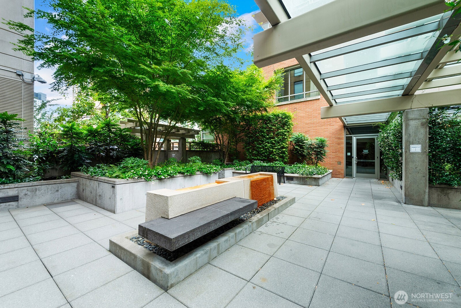 910 Lenora Street, Unit S403 Seattle, WA 98121 - Photo 26 of 40 a view of patio with a bench