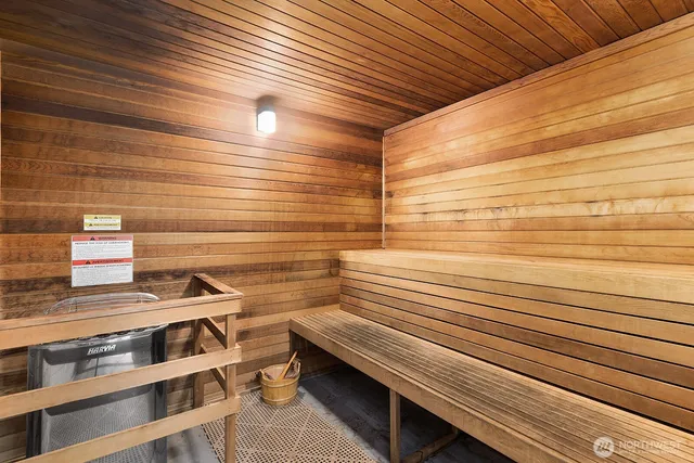 a bed room with furniture and a flat screen tv