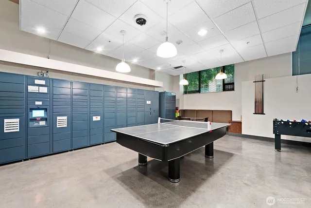a large kitchen with a table and chairs