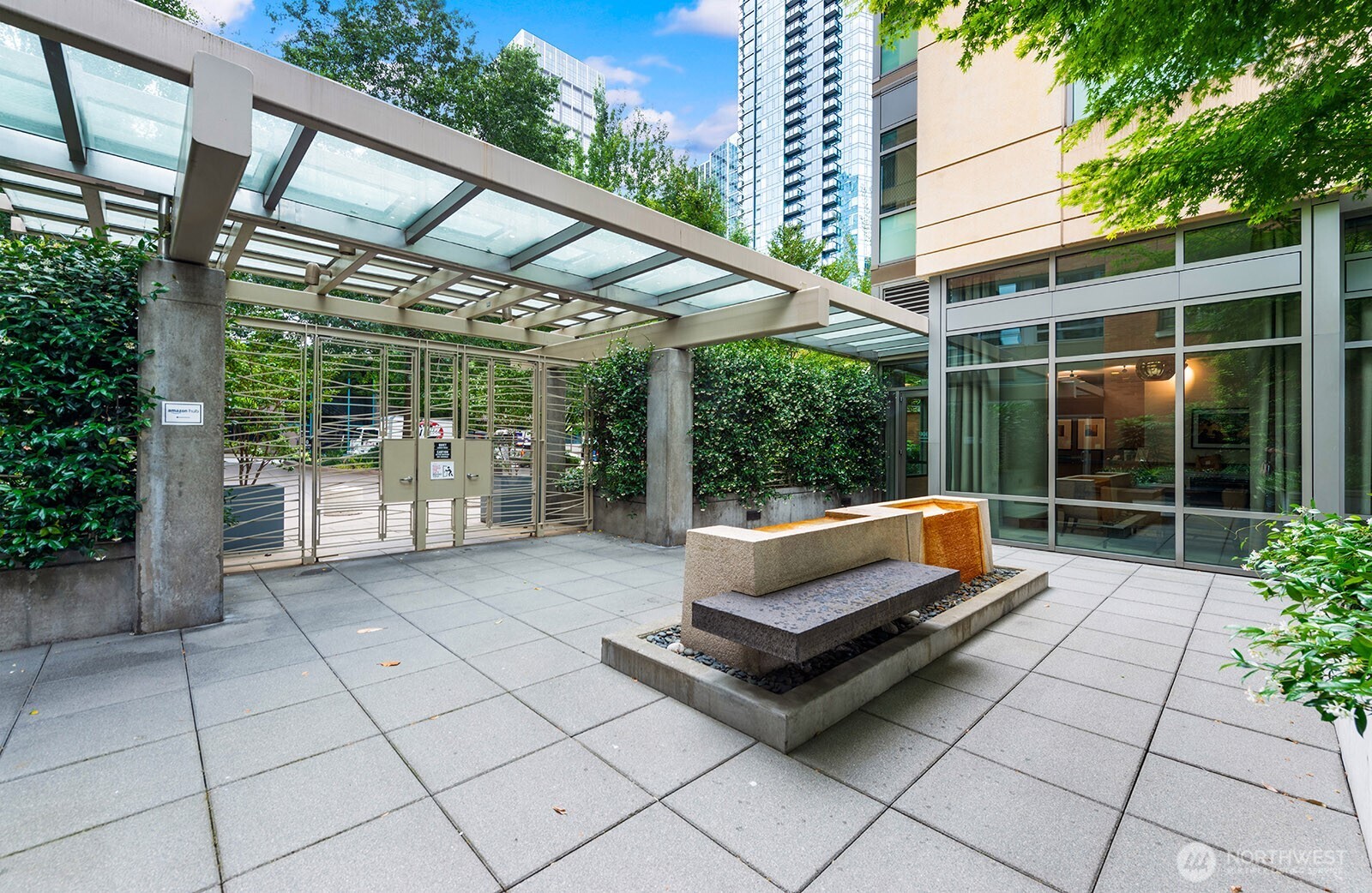 910 Lenora Street, Unit S403 Seattle, WA 98121 - Photo 3 of 40 a view of backyard with green space and porch