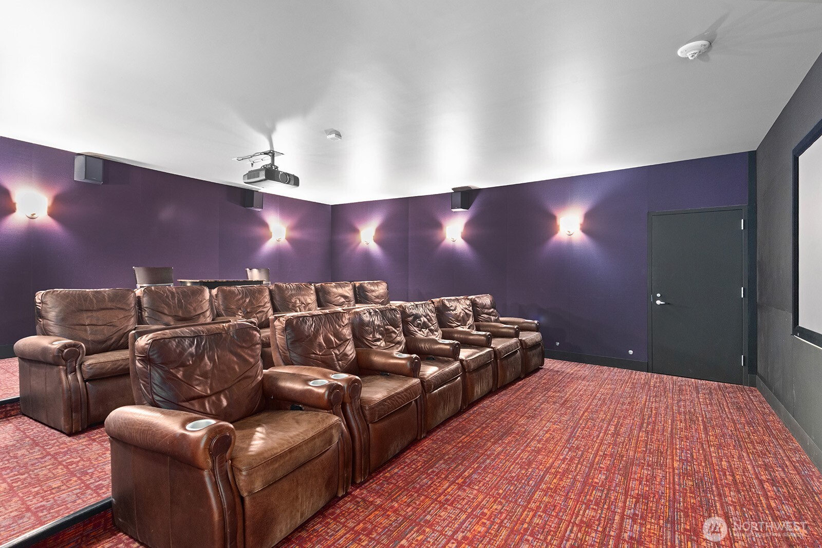 910 Lenora Street, Unit S403 Seattle, WA 98121 - Photo 31 of 40 a bed room with furniture and a flat screen tv