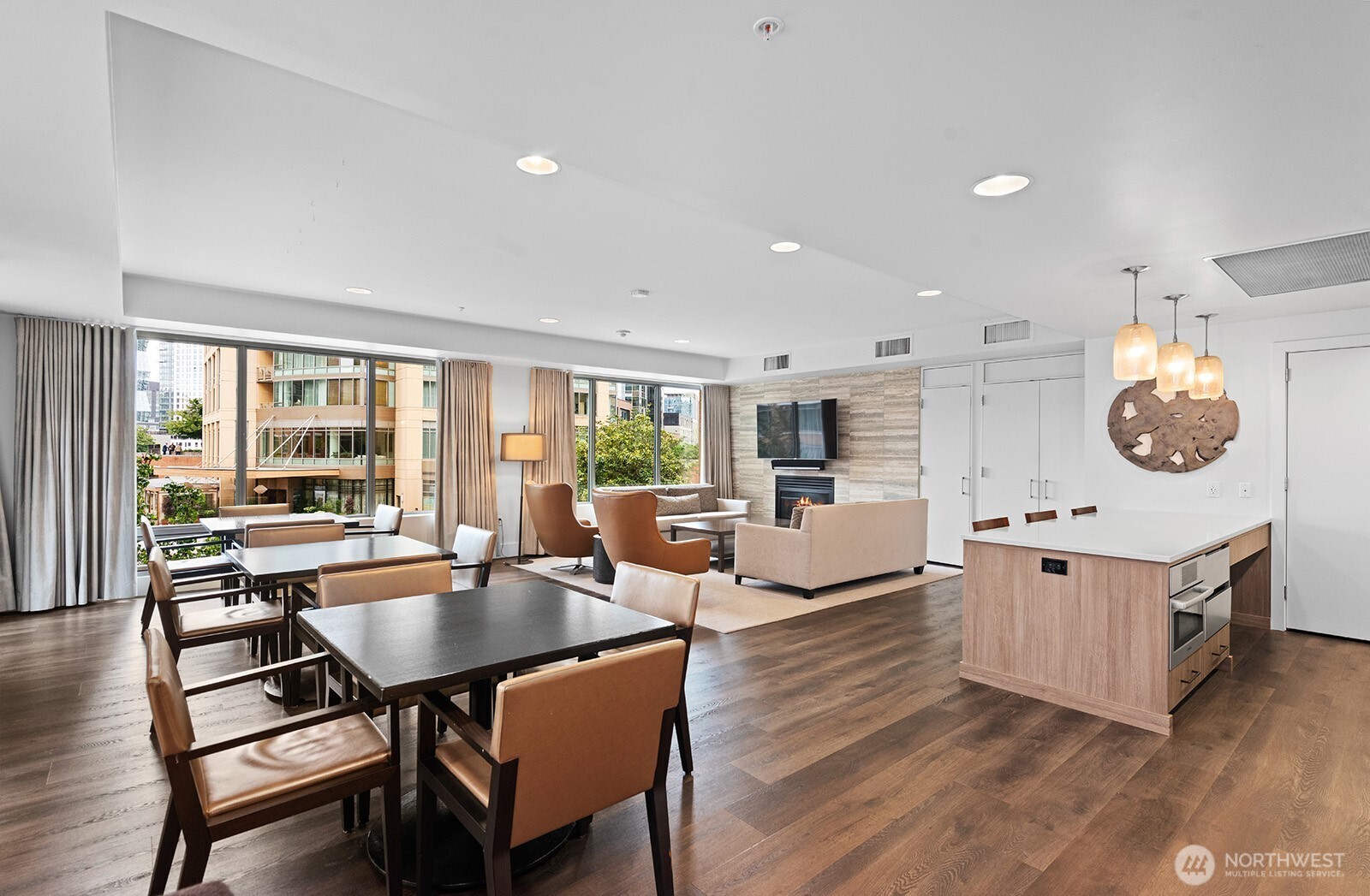910 Lenora Street, Unit S403 Seattle, WA 98121 - Photo 32 of 40 a large kitchen with a table and chairs