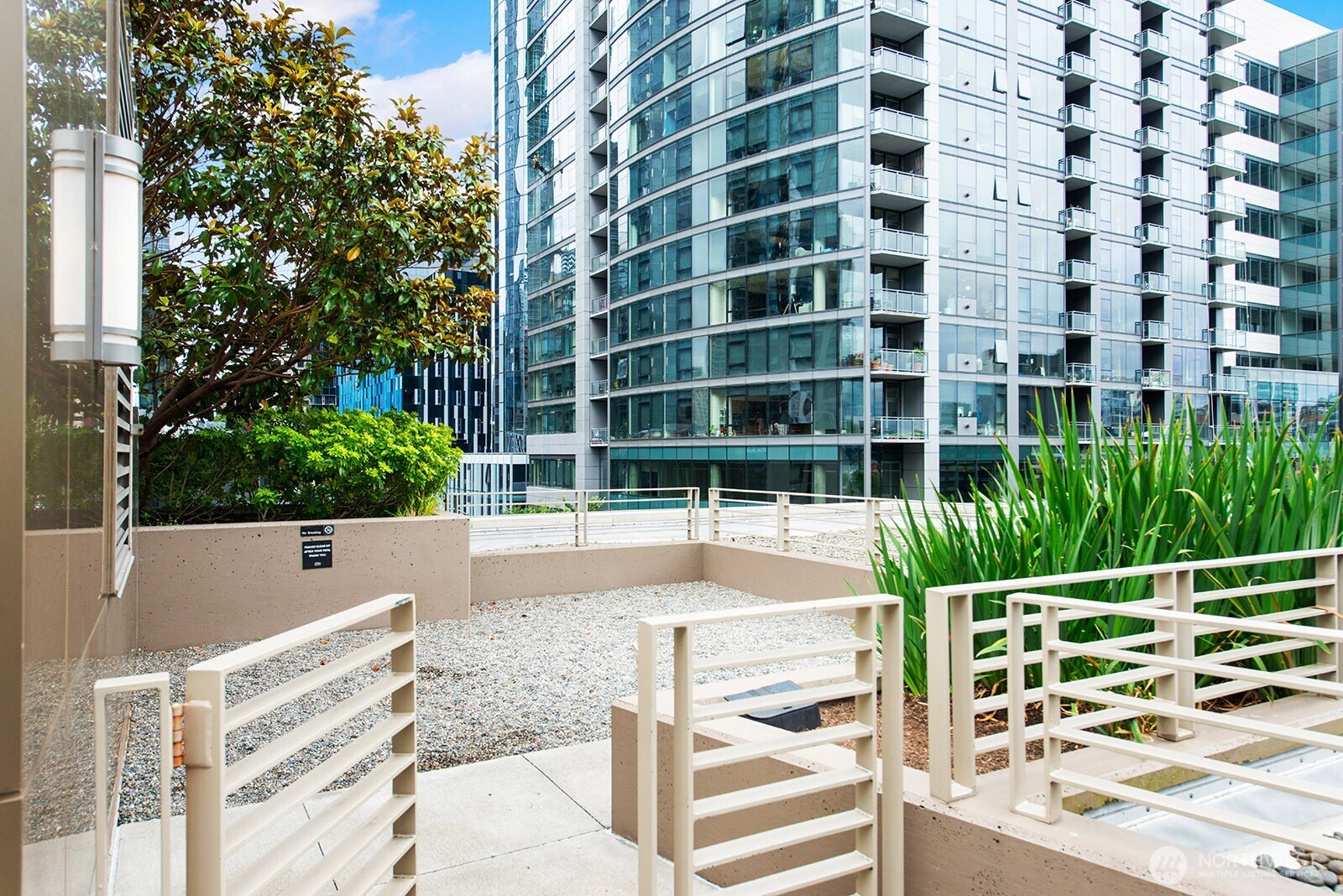 910 Lenora Street, Unit S403 Seattle, WA 98121 - Photo 34 of 40 a view of a building with a outdoor space