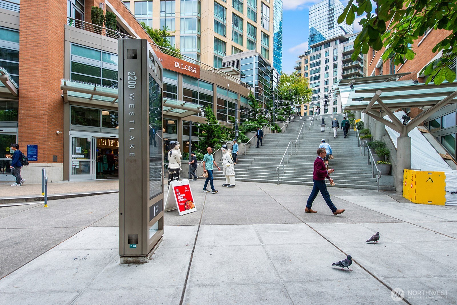 910 Lenora Street, Unit S403 Seattle, WA 98121 - Photo 37 of 40 a view of path along with retail shop and buildings
