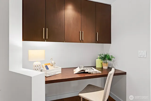 a room with a table chairs and utility room