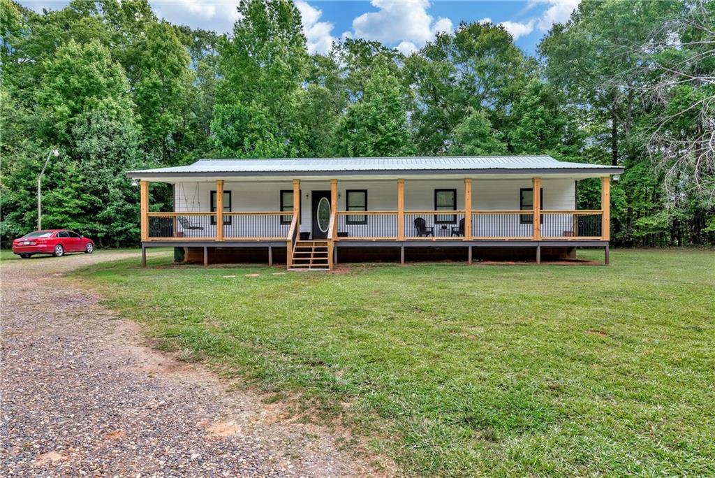 509 Geiger Road Jefferson, GA 30549 - Photo 1 of 1 a view of a house with a backyard and a patio