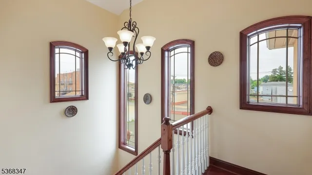 a front view of a house with windows and wooden floor