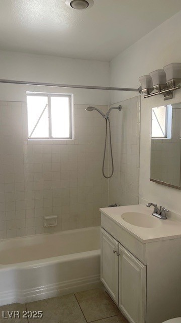 350 East Desert Inn Road, Unit B103 Las Vegas, NV 89109 - Photo 22 of 25 Bathroom with bathtub / shower combination, vanity, healthy amount of natural light, and light tile patterned flooring