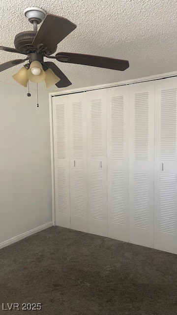 350 East Desert Inn Road, Unit B103 Las Vegas, NV 89109 - Photo 23 of 25 Bed 2 room ceiling fan, a closet, and dark colored carpet