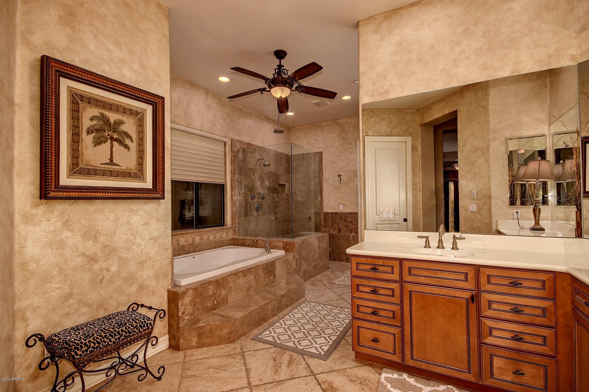 16417 South 23rd Way Phoenix, AZ 85048 - Photo 18 of 32 a spacious bathroom with a granite countertop sink a mirror a vanity and shower