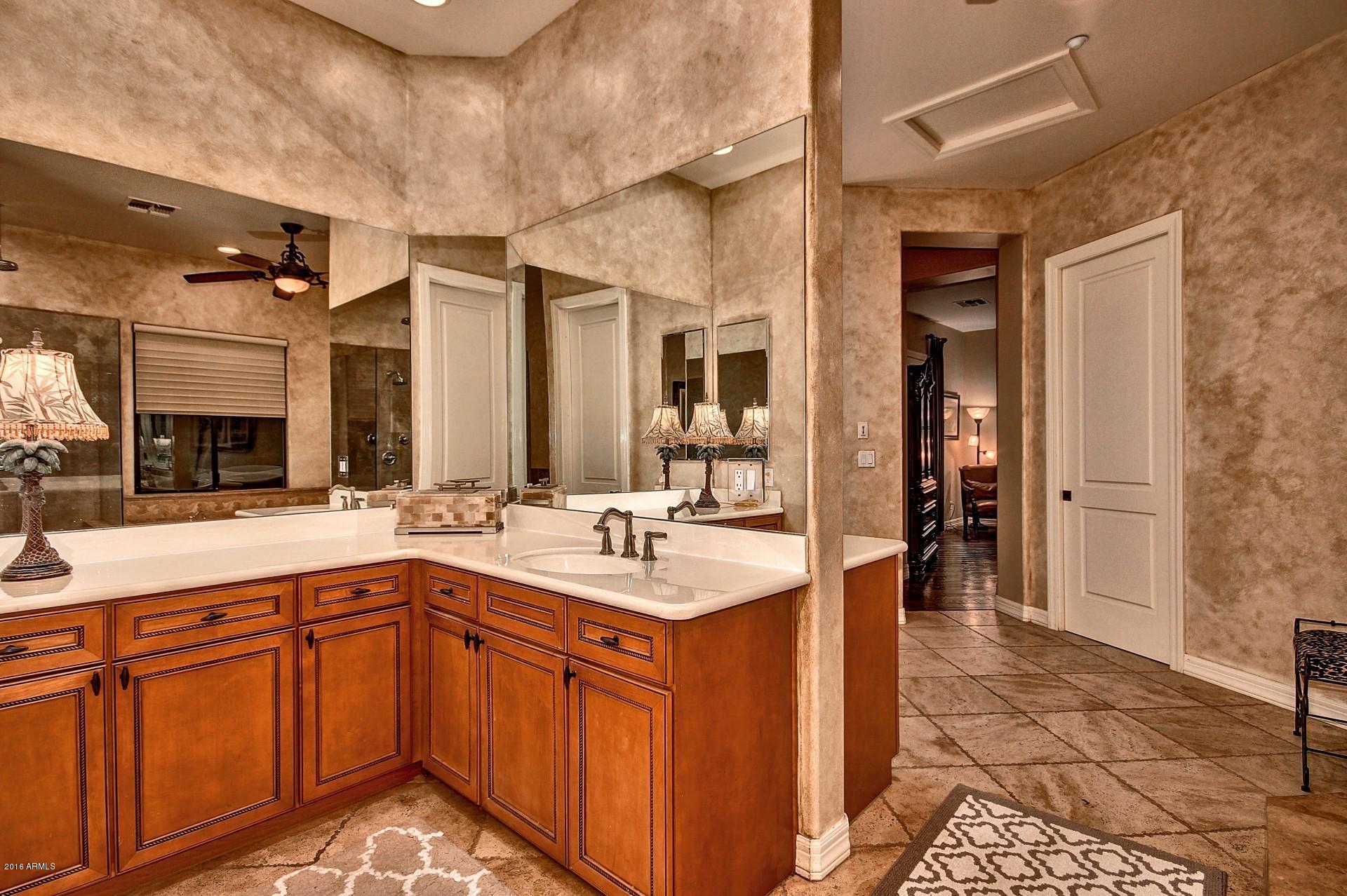 16417 South 23rd Way Phoenix, AZ 85048 - Photo 19 of 32 a large kitchen with stainless steel appliances granite countertop a sink and cabinets