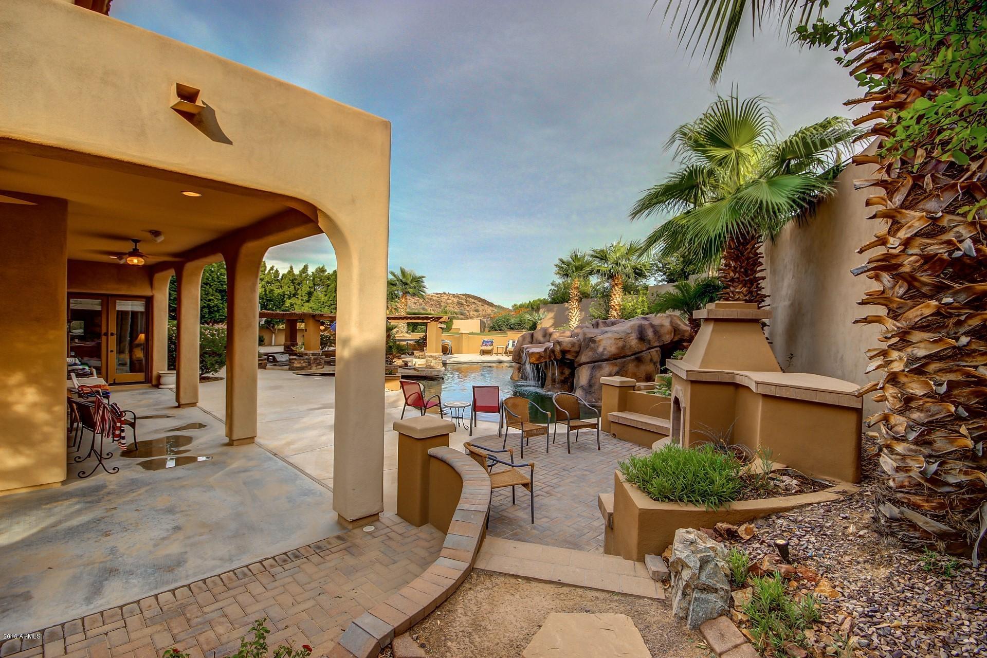 16417 South 23rd Way Phoenix, AZ 85048 - Photo 26 of 32 a view of a chairs and table in backyard