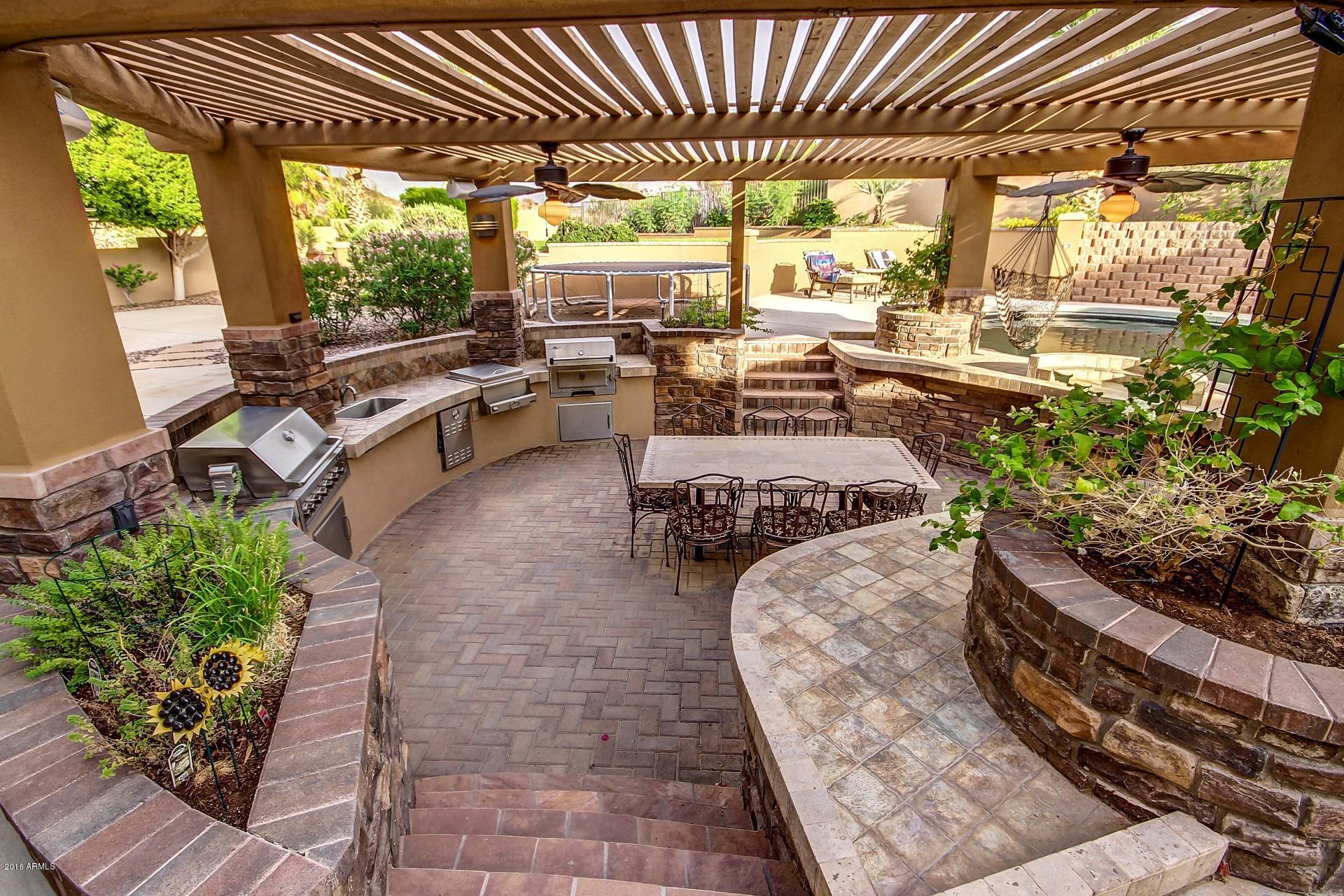 16417 South 23rd Way Phoenix, AZ 85048 - Photo 29 of 32 a living room with patio furniture and garden