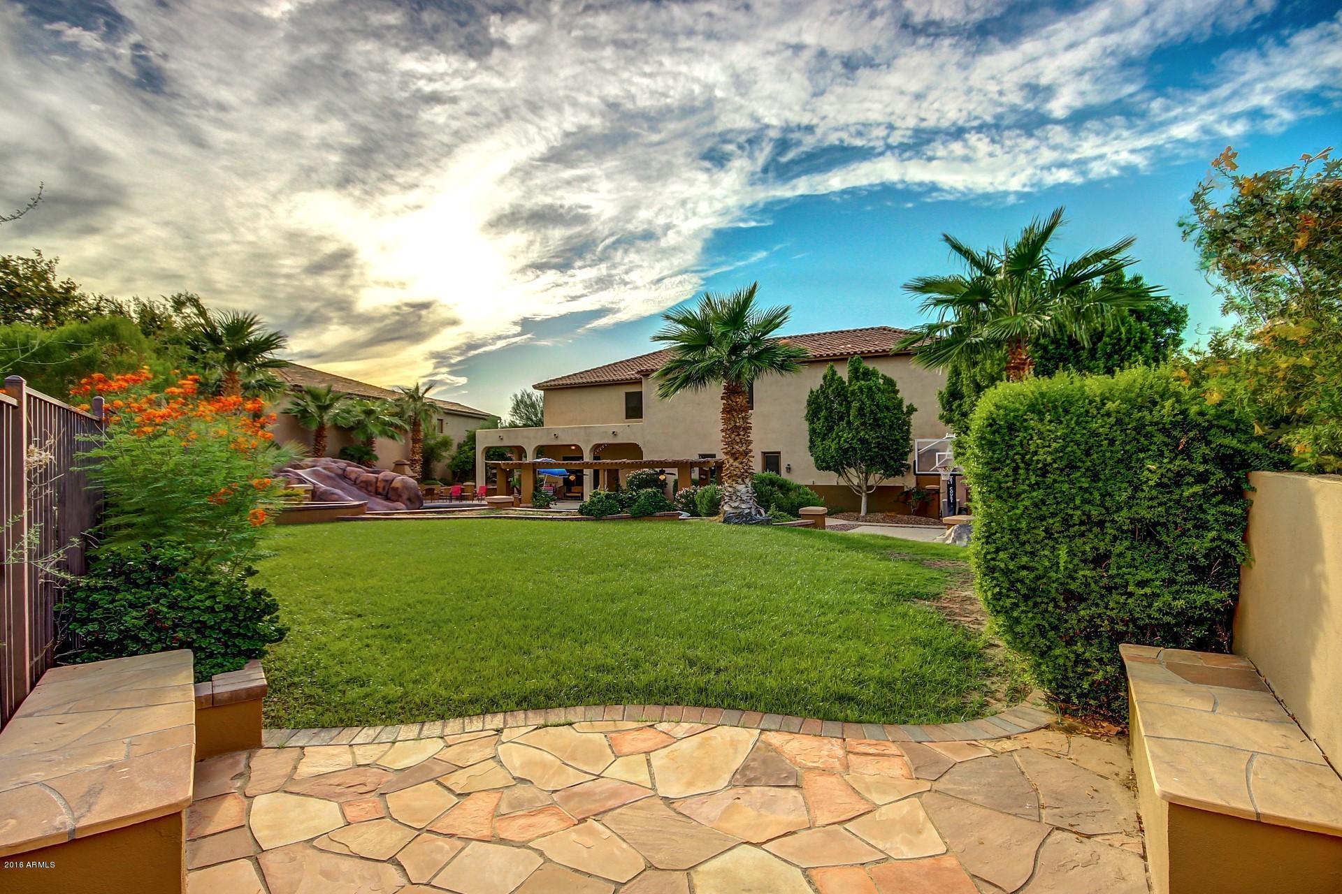 16417 South 23rd Way Phoenix, AZ 85048 - Photo 30 of 32 a view of a chairs and table in the garden