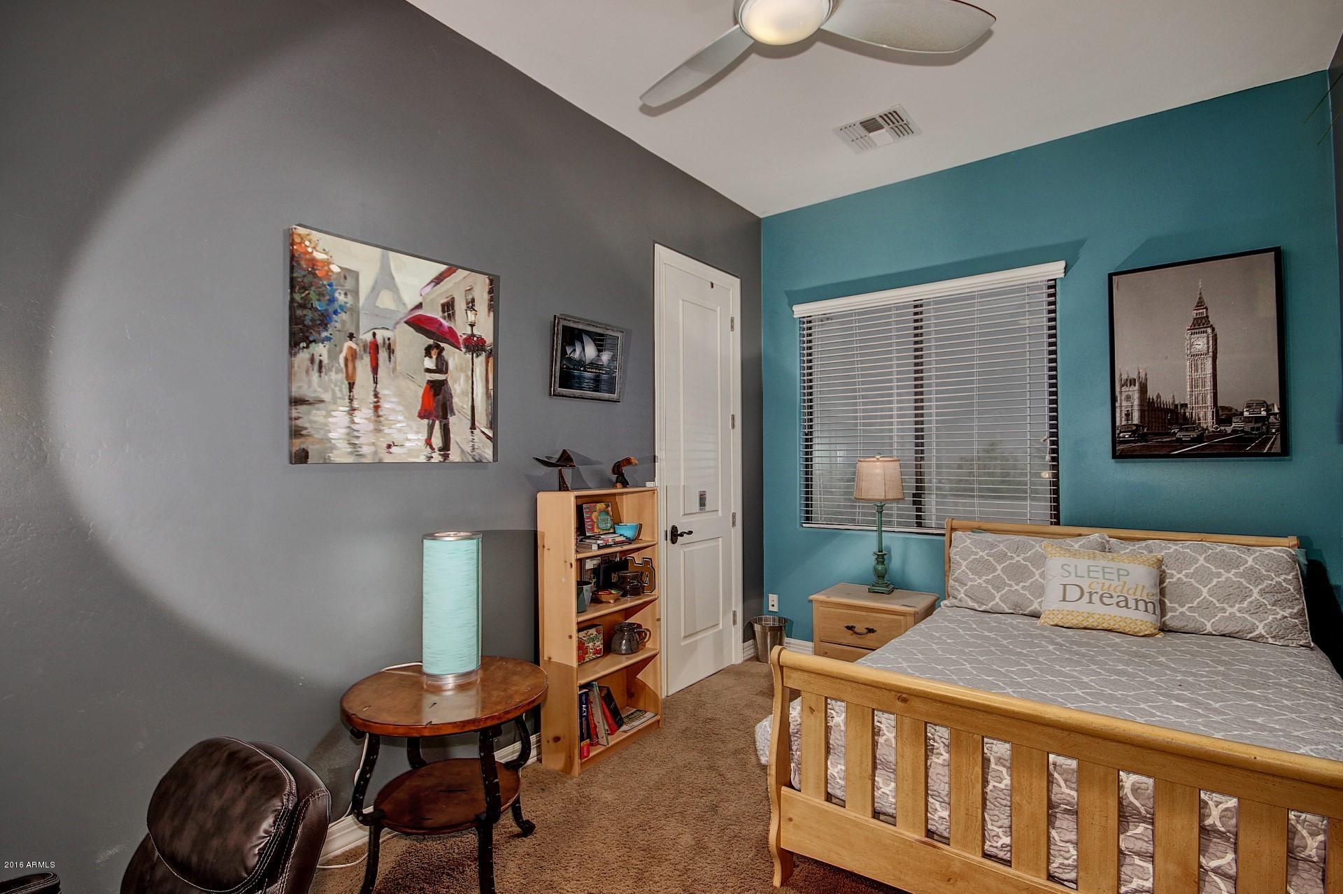 16417 South 23rd Way Phoenix, AZ 85048 - Photo 10 of 32 a bedroom with furniture and a book shelf