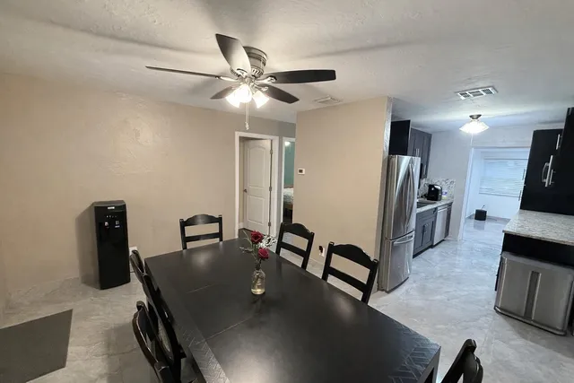 a view of a dining room with furniture