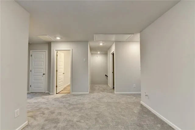 an empty room with closet area
