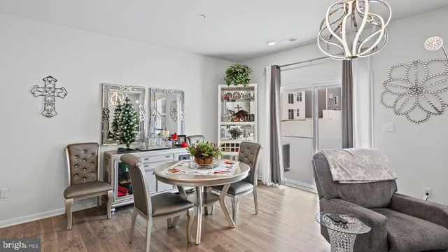 a view of a livingroom with furniture and wooden floor