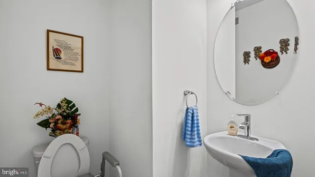 a bathroom with a sink mirror and vanity