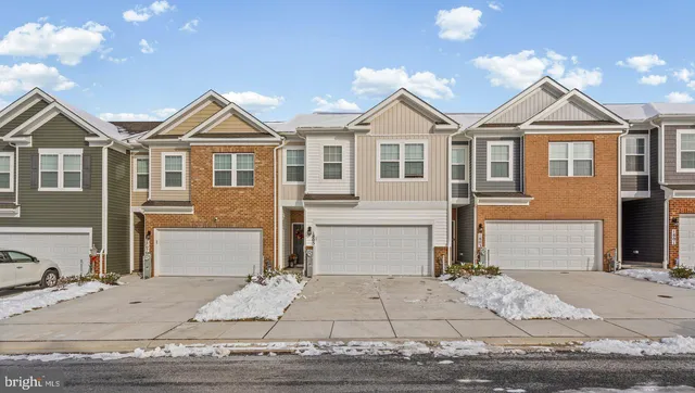 a view of a white house with large windows