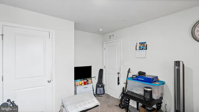 a room with furniture and a flat screen tv