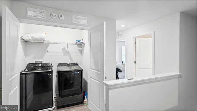 a black and white photo of a bench