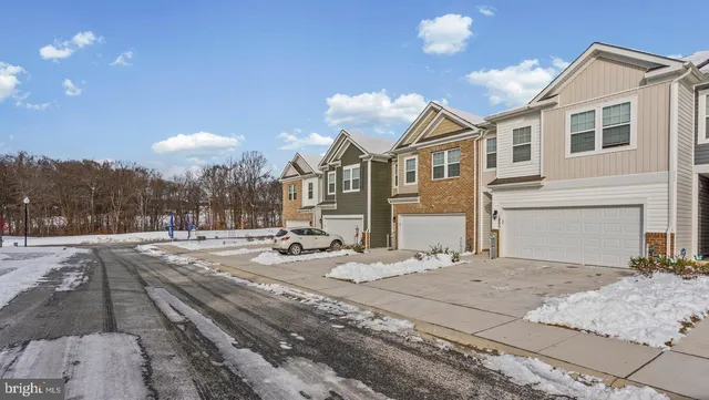 a view of a white apartments with large windows