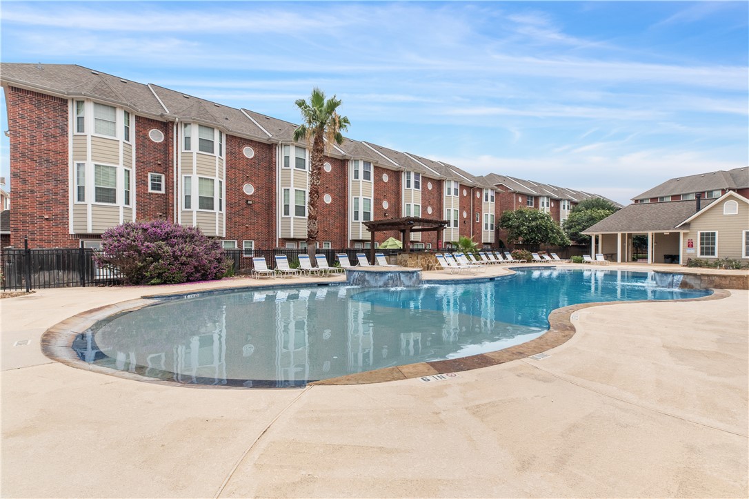 1198 Jones-Butler Road, Unit 1811 College Station, TX 77840 - Photo 13 of 26 a view of a house with a swimming pool