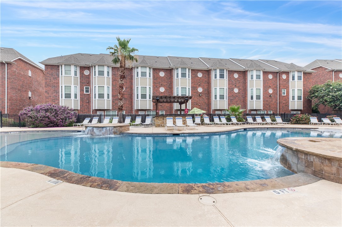 1198 Jones-Butler Road, Unit 1811 College Station, TX 77840 - Photo 14 of 26 a view of a swimming pool and a chairs