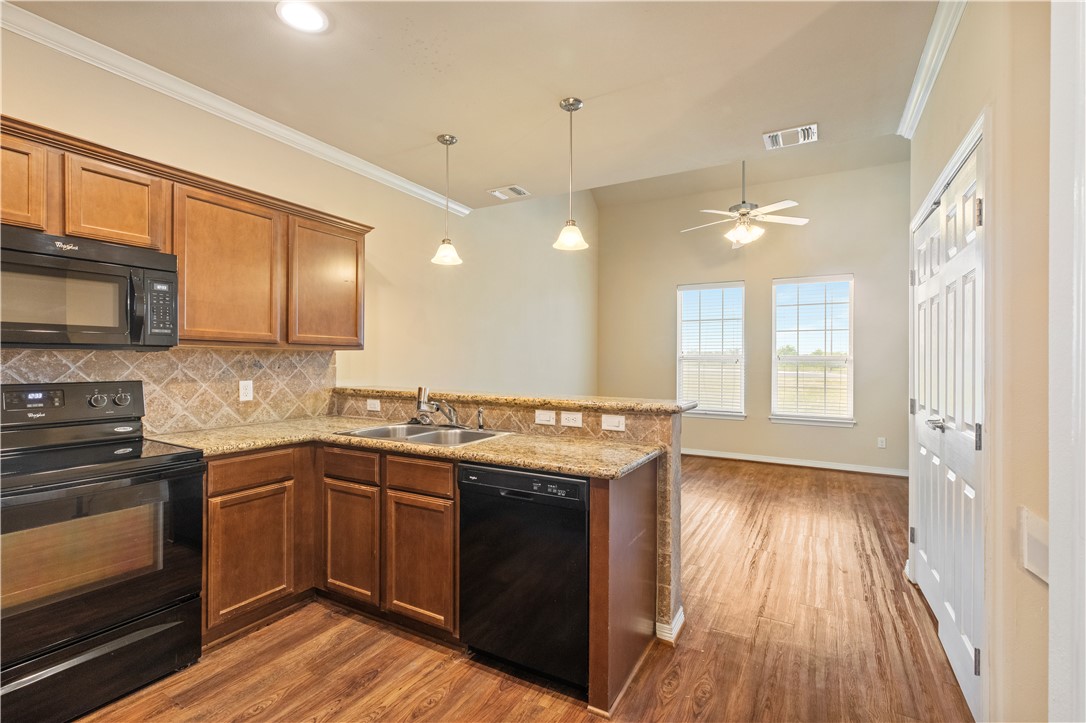 1198 Jones-Butler Road, Unit 1811 College Station, TX 77840 - Photo 4 of 26 a kitchen with a sink stove and cabinets