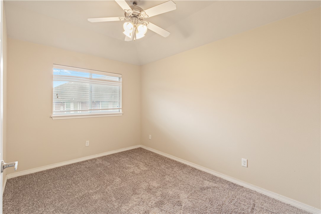 1198 Jones-Butler Road, Unit 1811 College Station, TX 77840 - Photo 10 of 26 an empty room with a window and a fan