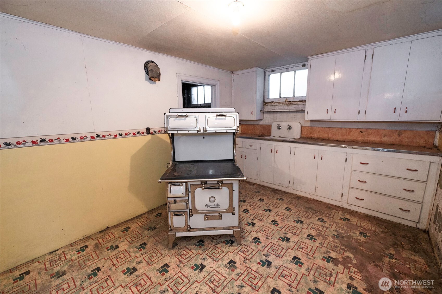 40 Northwest B Street College Place, WA 99324 - Photo 22 of 29 a kitchen with granite countertop a sink cabinets and stainless steel appliances