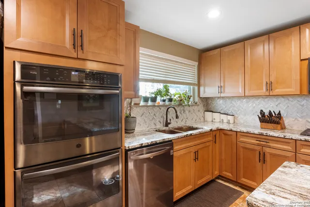 a kitchen with a sink and cabinets