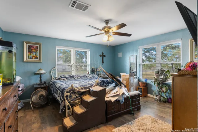 a bedroom with bed and a window