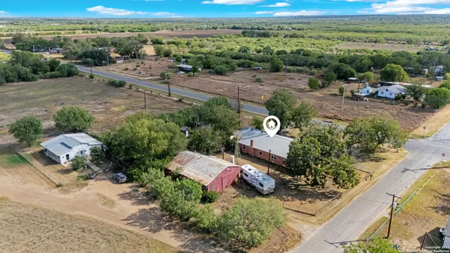 an aerial view of a house with a garden