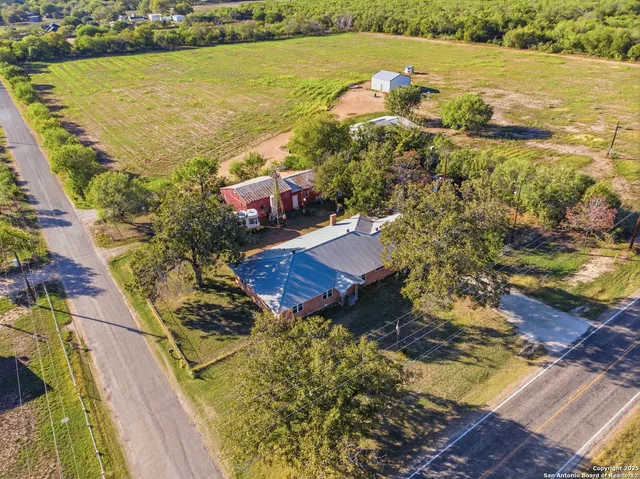 an aerial view of residential houses with outdoor space