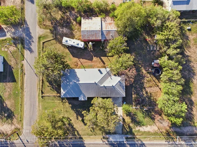 a view of yard with swimming pool and green space
