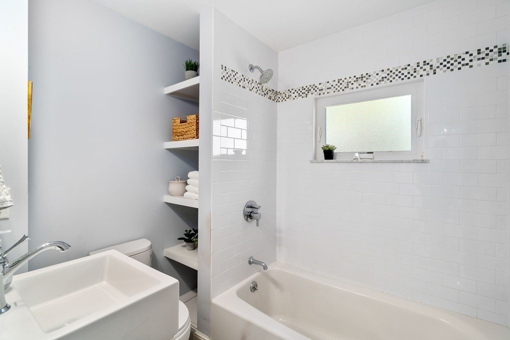 91 Fayette Street, Unit 91 Watertown, MA 02472 - Photo 12 of 21 a bathroom with a sink a toilet and shower