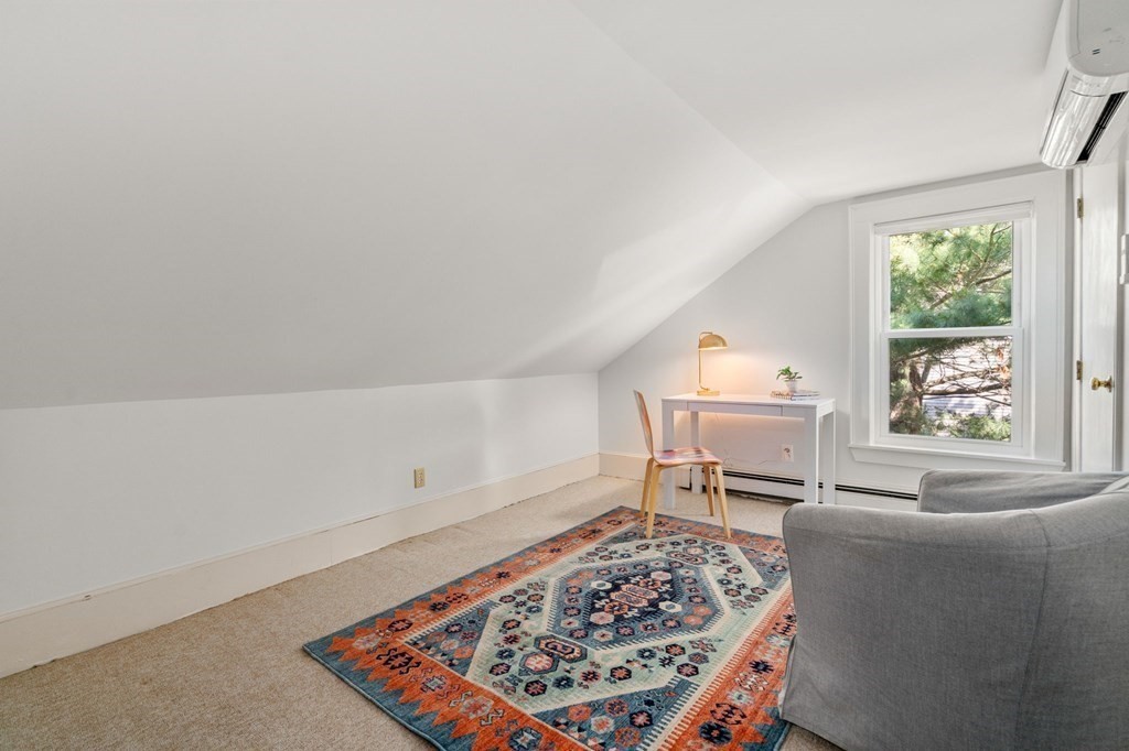 91 Fayette Street, Unit 91 Watertown, MA 02472 - Photo 13 of 21 a living room with a couch and a table