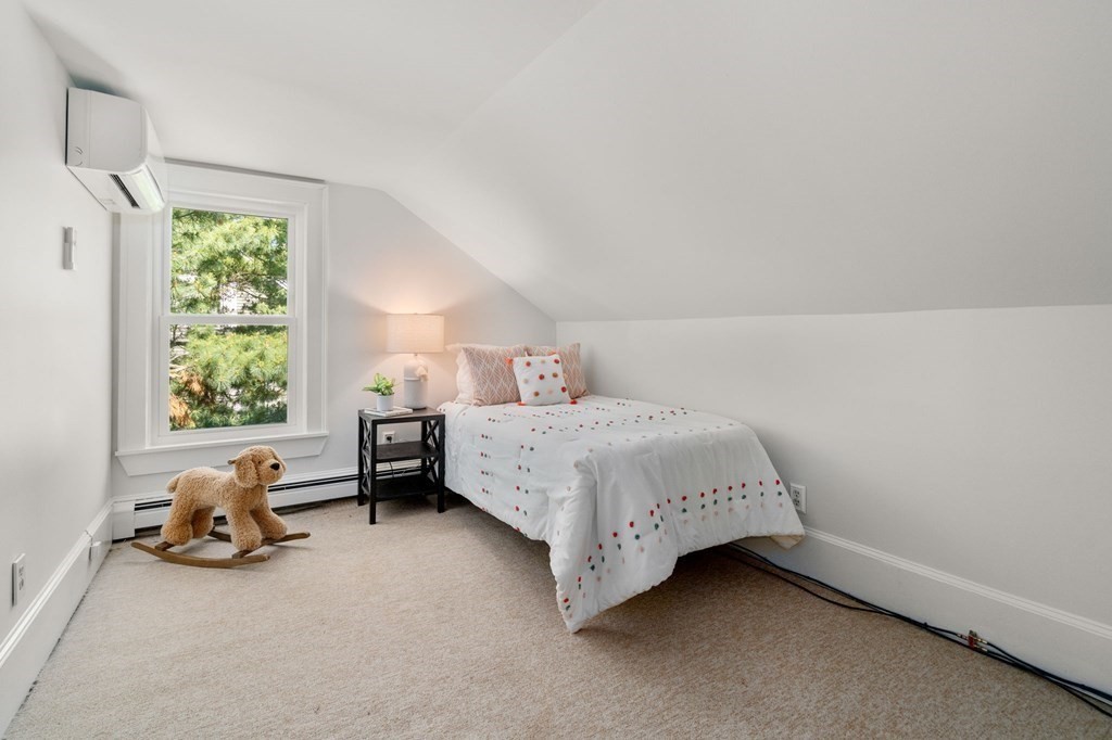 91 Fayette Street, Unit 91 Watertown, MA 02472 - Photo 14 of 21 a bedroom with a bed and a window