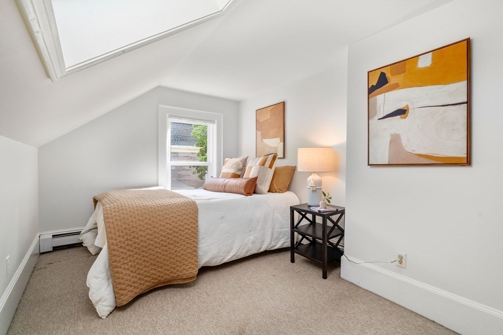 91 Fayette Street, Unit 91 Watertown, MA 02472 - Photo 15 of 21 a bedroom with a bed and a window