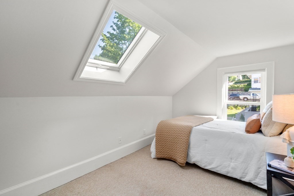 91 Fayette Street, Unit 91 Watertown, MA 02472 - Photo 16 of 21 a bedroom with a bed and window