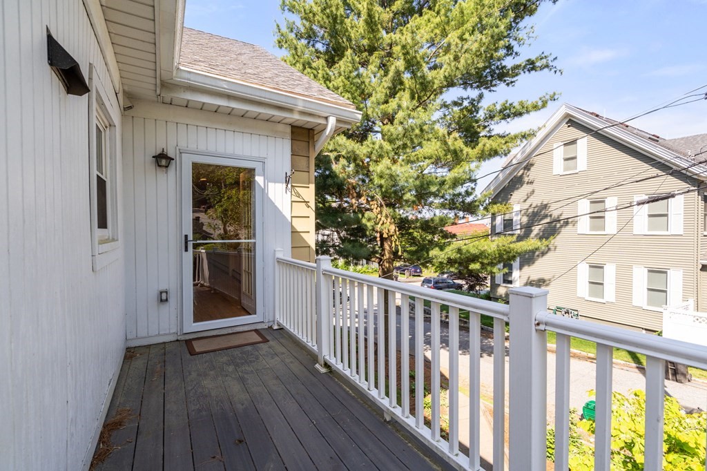 91 Fayette Street, Unit 91 Watertown, MA 02472 - Photo 21 of 21 a view of a porch with wooden floor and fence