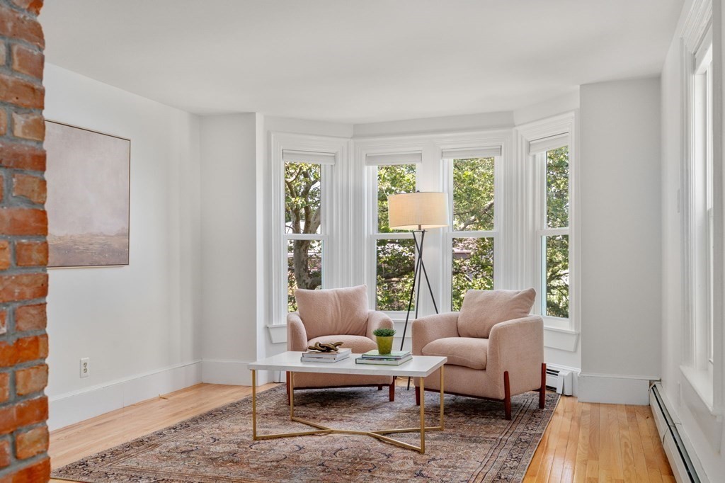 91 Fayette Street, Unit 91 Watertown, MA 02472 - Photo 3 of 21 a living room with furniture and a large window