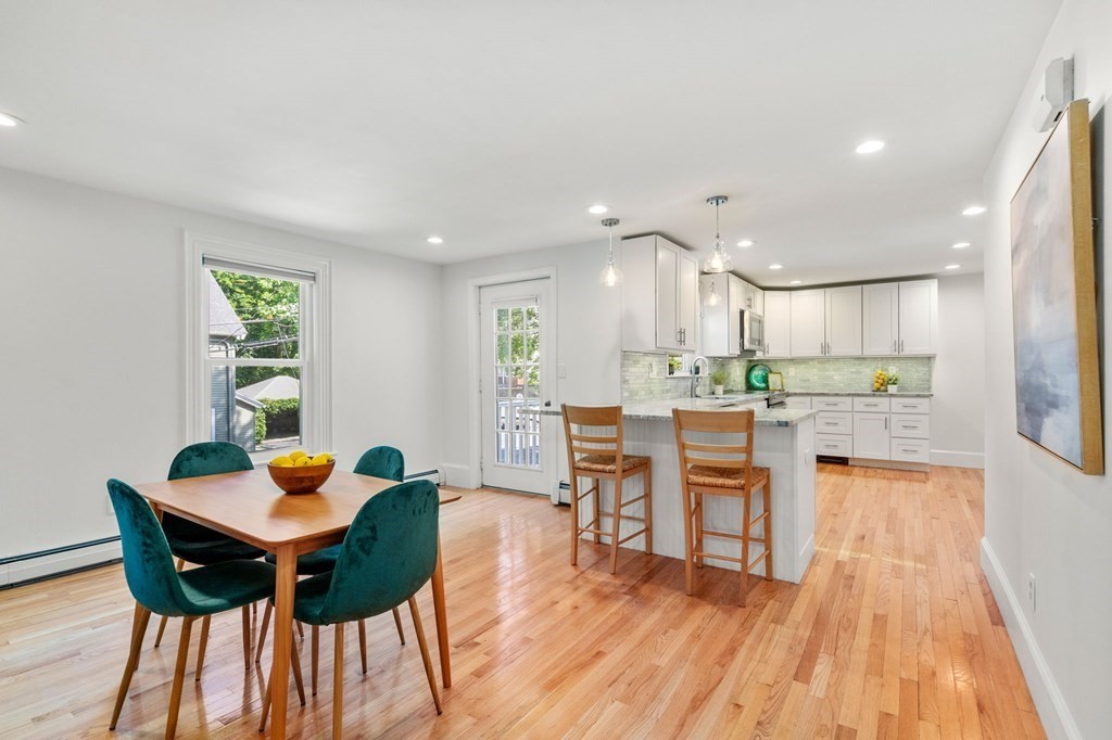 91 Fayette Street, Unit 91 Watertown, MA 02472 - Photo 6 of 21 a view of a dining room with furniture and wooden floor